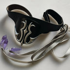 Black eye mask with silver flame emblem and satin ribbon ties