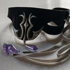 Black eye mask with cutout sides, silver flame emblem, silver satin ribbon ties