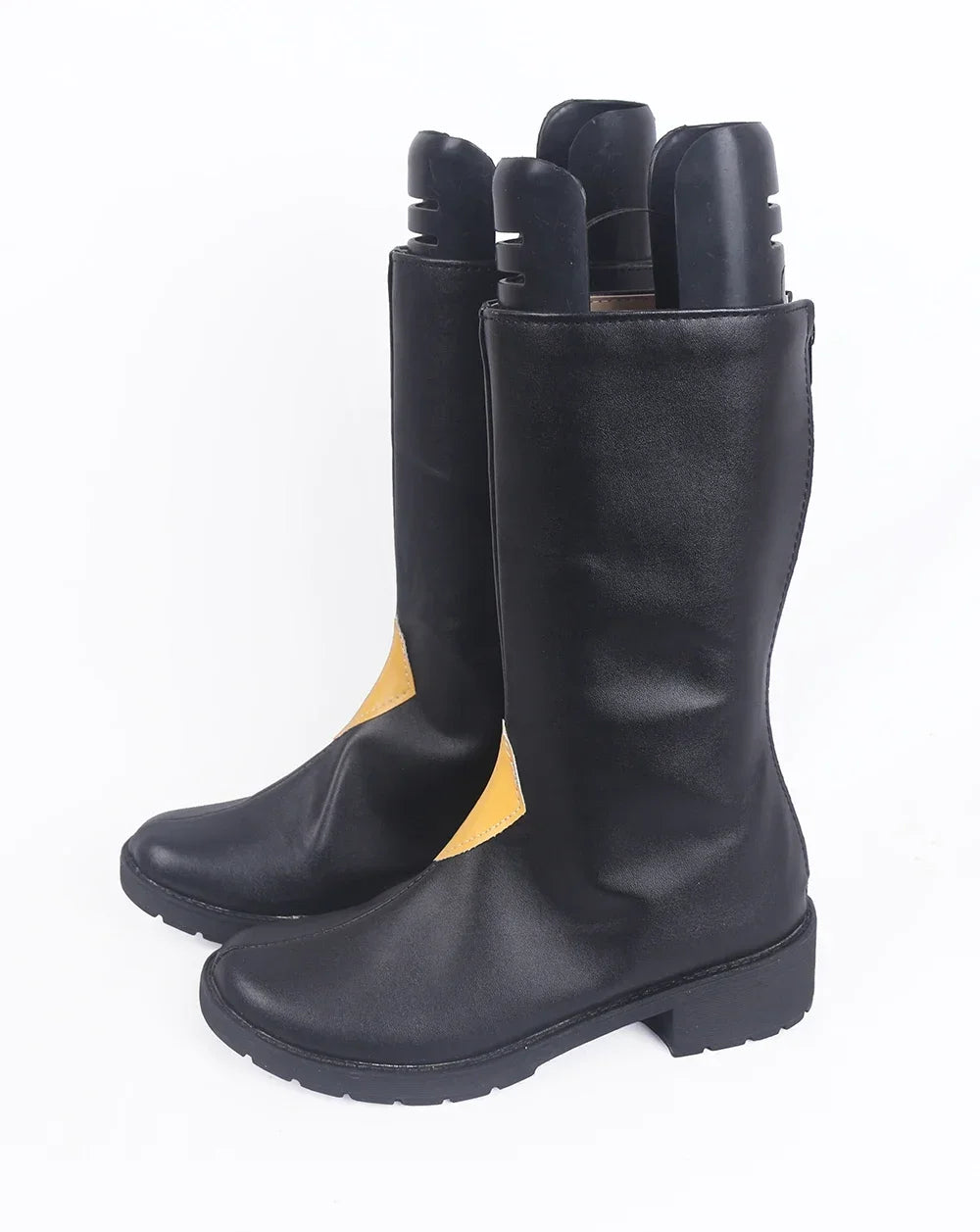 Black cosplay boots close-up with yellow side panel and thick rubber sole