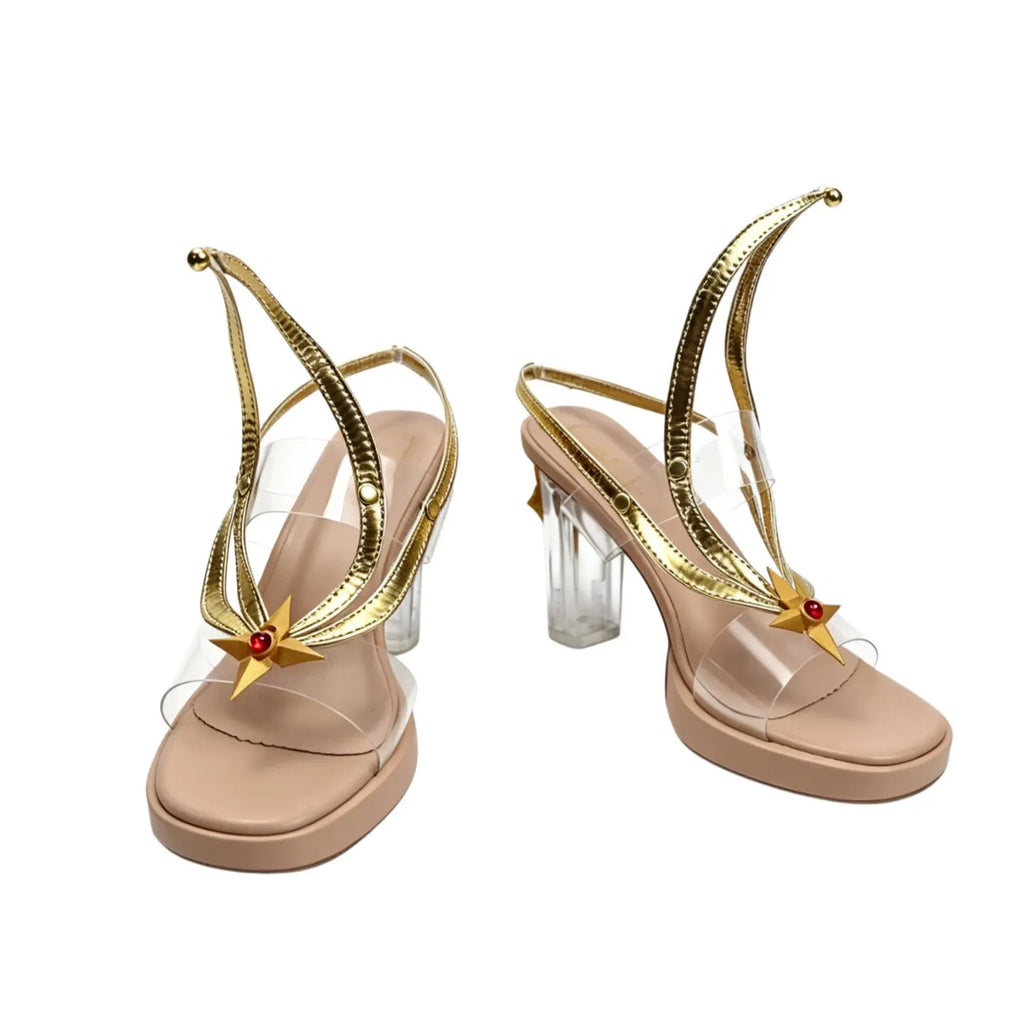 Nude pink high-heel sandals with gold trim, transparent heels, red jeweled strap accents