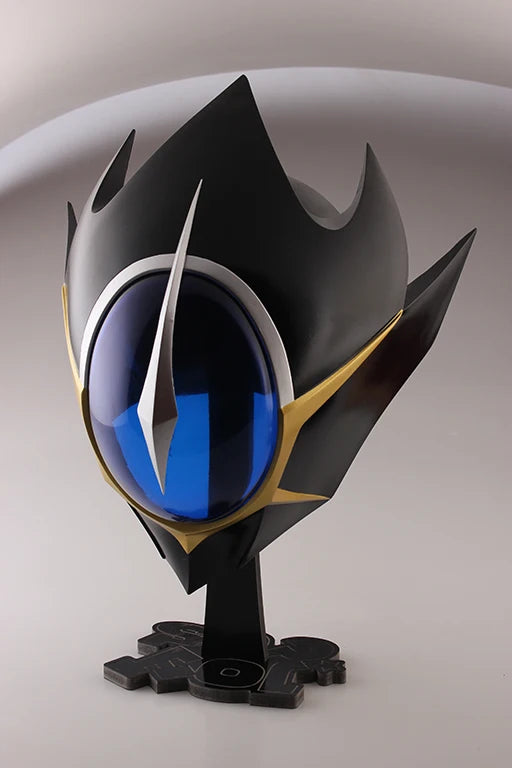 Black cosplay helmet with blue visor and gold trim, displayed on a base stand