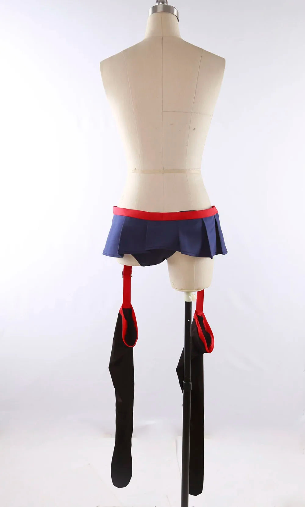 Cosplay costume on mannequin, front view: navy skirt, red garters, black long thigh accessories